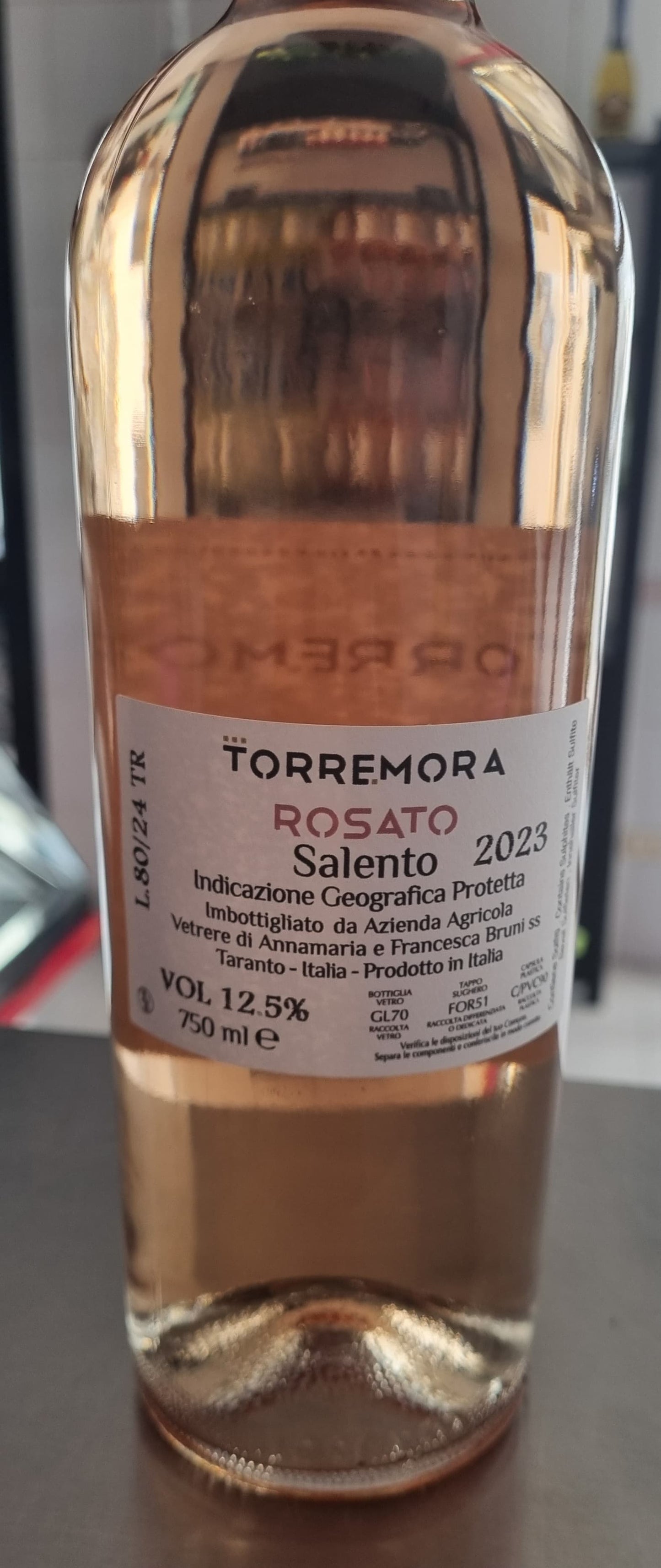 Rosato del Salento 2023 wine bottle with label detailing its geographic origin and alcohol content.
